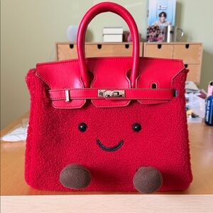 Red Fuzzy Handbag with Smiley Face. Shoulder strap